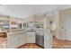 Bright eat-in kitchen features stainless steel appliances, an island, and plenty of counter space for cooking at 6620 Saint James Xing, University Park, FL 34201