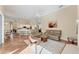 Spacious living room with an open floor plan and views of the adjacent eat-in kitchen and dining areas at 6620 Saint James Xing, University Park, FL 34201