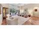 Bright living room with a view of the pool and a neutral palette, perfect for relaxing and entertaining at 6620 Saint James Xing, University Park, FL 34201