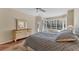 Main bedroom featuring large windows with natural light and tile floors at 6620 Saint James Xing, University Park, FL 34201