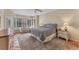 Spacious main bedroom with plush carpet, bay windows, and cozy sitting area at 6620 Saint James Xing, University Park, FL 34201