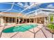 The outdoor pool is perfect for recreation, surrounded by brick pavers and a screened enclosure for outdoor enjoyment at 6620 Saint James Xing, University Park, FL 34201