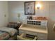 Bright bedroom featuring a desk, chair, bed with patterned comforter, and artwork at 6882 Holo Ct, North Port, FL 34287