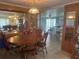 Open-concept room with eat-in kitchen flowing into dining area, complete with tile flooring at 6882 Holo Ct, North Port, FL 34287