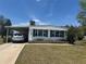 Charming single-story home with a covered parking area and well-maintained landscaping at 6882 Holo Ct, North Port, FL 34287