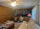 Spacious living room boasts a built-in bookcase and unique coffee table at 6882 Holo Ct, North Port, FL 34287
