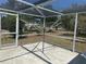 Backyard clothesline seen through the screened-in patio at 6882 Holo Ct, North Port, FL 34287