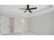 Spacious bedroom with walk-in closet, ceiling fan, and ample natural light at 7116 Quarry St, Englewood, FL 34224