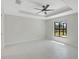 Bright bedroom features a ceiling fan, tray ceiling and natural light at 7116 Quarry St, Englewood, FL 34224
