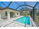 Screened pool area with covered patio and spacious deck, great for outdoor entertaining at 7116 Quarry St, Englewood, FL 34224