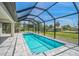Gorgeous in-ground pool and spa within a screened enclosure, offering privacy and relaxation at 7116 Quarry St, Englewood, FL 34224