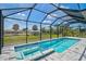 Beautiful in-ground pool and spa with a screened enclosure at 7116 Quarry St, Englewood, FL 34224
