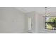 Bright room with white walls and trim, complemented by a window for lots of natural light at 7116 Quarry St, Englewood, FL 34224