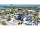 Beautiful aerial view of a luxurious home near the bay with a pool, rooftop deck and landscaped yard at 723 S Blvd Of The Presidents, Sarasota, FL 34236