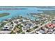 Stunning aerial showcases beautiful waterfront homes and lush landscaping at 723 S Blvd Of The Presidents, Sarasota, FL 34236