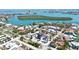 Beautiful aerial view of the neighborhood with stunning water views, lush greenery, and gorgeous homes at 723 S Blvd Of The Presidents, Sarasota, FL 34236