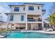 Luxury home showcasing an inviting pool, outdoor seating, and a stylish pool table area at 723 S Blvd Of The Presidents, Sarasota, FL 34236