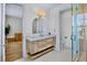 Elegant bathroom showcasing a wooden vanity, modern fixtures, and a glass-enclosed shower at 723 S Blvd Of The Presidents, Sarasota, FL 34236