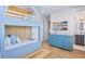 room with built in bunk beds, blue dresser, TV, and an adjacent bathroom at 723 S Blvd Of The Presidents, Sarasota, FL 34236