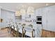 Gourmet kitchen with white cabinets, stainless appliances, and a large center island at 723 S Blvd Of The Presidents, Sarasota, FL 34236