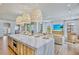 Bright, open kitchen and living area is perfect for entertaining with designer touches at 723 S Blvd Of The Presidents, Sarasota, FL 34236