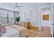 Elegant main bedroom with stylish decor, a large window, and modern furniture at 723 S Blvd Of The Presidents, Sarasota, FL 34236
