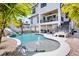 Resort-style pool with a water fountain, slide, and ample space for entertainment at 723 S Blvd Of The Presidents, Sarasota, FL 34236