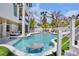 Lush backyard featuring a swimming pool with a swim up table and landscaped surroundings at 723 S Blvd Of The Presidents, Sarasota, FL 34236