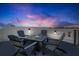 Inviting rooftop deck boasts a fire pit, chairs, and relaxing space to gather with spectacular views at sunset at 723 S Blvd Of The Presidents, Sarasota, FL 34236