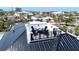 Relaxing rooftop deck features a fire pit and seating, perfect for enjoying the outdoor scenery at 723 S Blvd Of The Presidents, Sarasota, FL 34236