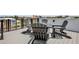 Outdoor patio with a set of seating, black railings, and neighborhood views at 723 S Blvd Of The Presidents, Sarasota, FL 34236