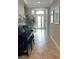 Elegant entryway featuring neutral walls, stylish tile flooring, and a grand piano, creating a welcoming atmosphere at 7360 Talon Bay Dr, North Port, FL 34287