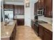 Well-equipped kitchen with granite countertops, stainless steel appliances, and ample cabinet space at 7360 Talon Bay Dr, North Port, FL 34287