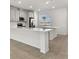 Bright kitchen featuring quartz countertops, modern appliances and sleek cabinets at 7424 Cabin Ln, Sarasota, FL 34240