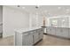 Open kitchen with a large island, stainless steel appliances, and recessed lighting at 7424 Cabin Ln, Sarasota, FL 34240