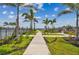 Walkway through manicured landscaping at 7424 Cabin Ln, Sarasota, FL 34240
