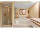 This luxurious bathroom has both a soaking tub and separate shower enclosure at 7639 Fairway Woods Dr # 605, Sarasota, FL 34238