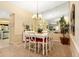 The dining room has ample seating for six, and is adjacent to the kitchen at 7639 Fairway Woods Dr # 605, Sarasota, FL 34238
