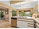 This open kitchen is flooded with natural light and features ample counter space and stainless steel appliances at 7639 Fairway Woods Dr # 605, Sarasota, FL 34238