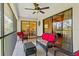 Covered lanai featuring comfortable seating and panoramic views of the surrounding landscape at 7639 Fairway Woods Dr # 605, Sarasota, FL 34238