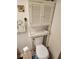 Bathroom featuring an over-the-toilet cabinet, toilet and roll paper at 808 53Rd E Ave # 229, Bradenton, FL 34203