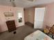 Bedroom with pink walls, carpet, furniture and doorway to another room at 808 53Rd E Ave # 229, Bradenton, FL 34203