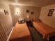 Cozy bedroom showcasing two twin beds and decorative wall art at 808 53Rd E Ave # 229, Bradenton, FL 34203