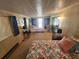 Bedroom featuring two beds, comfortable seating, and natural light at 808 53Rd E Ave # 229, Bradenton, FL 34203
