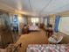 Spacious bedroom featuring two beds, comfortable seating and a large mirror at 808 53Rd E Ave # 229, Bradenton, FL 34203