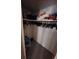 A well-organized closet with clothes and boxes on the shelf in the house at 808 53Rd E Ave # 229, Bradenton, FL 34203