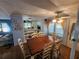 Inviting dining space with a ceiling fan, open shelving, and easy access to other living areas at 808 53Rd E Ave # 229, Bradenton, FL 34203