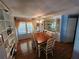 Spacious dining area featuring a stylish table set, built-in shelving, and bright windows at 808 53Rd E Ave # 229, Bradenton, FL 34203