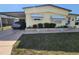 Charming home with a covered carport, tidy landscaping, and a welcoming facade at 808 53Rd E Ave # 229, Bradenton, FL 34203