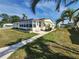 Lovely home featuring a screened lanai, manicured lawn, and a cozy, inviting entrance at 808 53Rd E Ave # 229, Bradenton, FL 34203